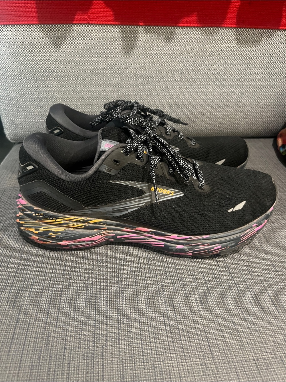 Brooks Women’s Black Running Sneakers with Pink & Yellow Sole Accents